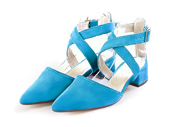Turquoise blue women's open back shoes, with crossed straps. Tapered toe. Low flare heels. Front view - Florence KOOIJMAN